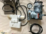 On Demand Air Pump With Water Flow Switch Attached & Mounting Bracket. Fixed Price $250.00.