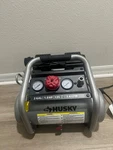Husky 2 Gal. 135 Psi Portable Electric Oil-free Quiet Air Compressor W/ Gauges. Fixed Price $150.00.